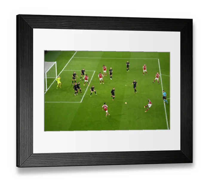 Framed Print : Arsenal's Pepe Fires Shot in Empty Europa League Clash Against Dundalk