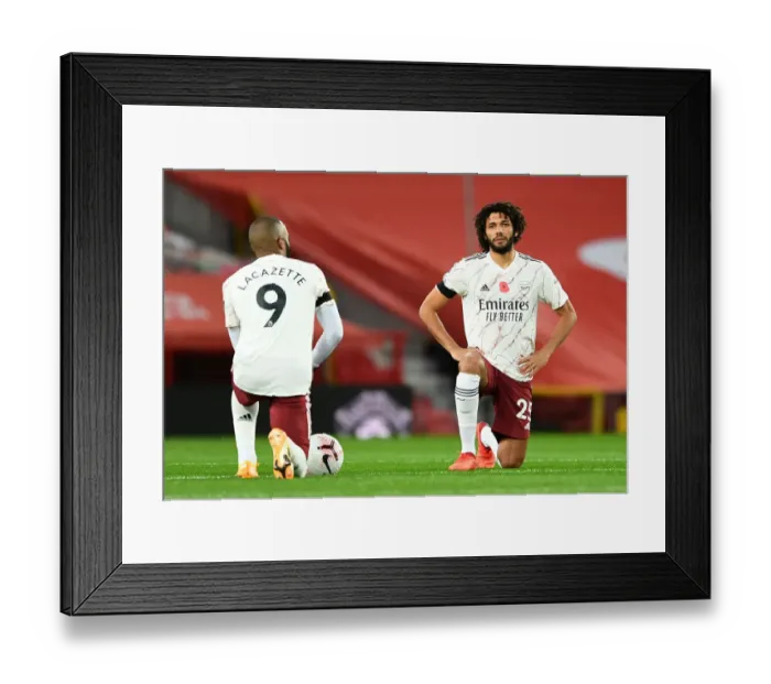 Framed Print : Arsenal's Elneny Kneels at Empty Old Trafford in Manchester United vs Arsenal (2020-21)