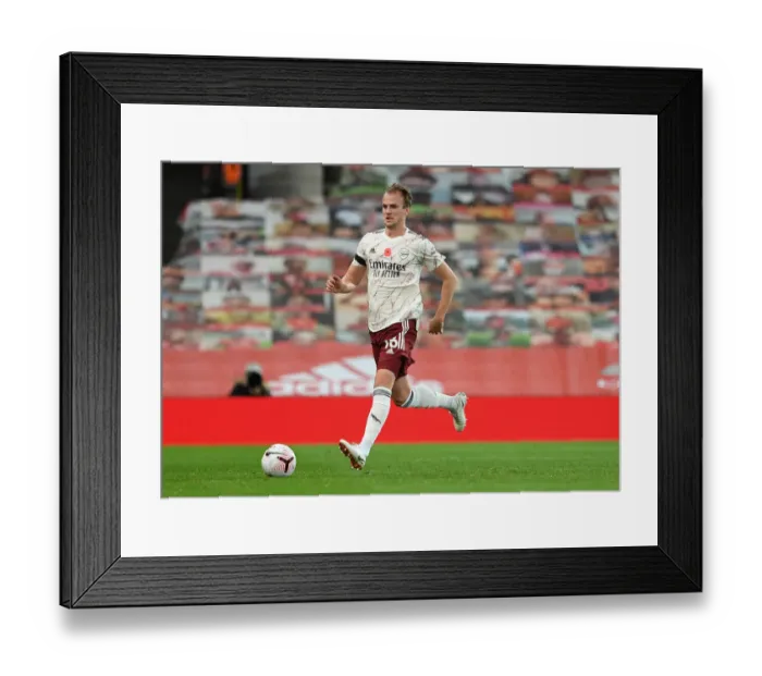 Framed Print : Empty Old Trafford: Arsenal's Rob Holding Faces Manchester United in Pandemic-Hit Premier League Framed Print : Empty Old Trafford: Arsenal's Rob Holding Faces Manchester United in Pandemic-Hit Premier League