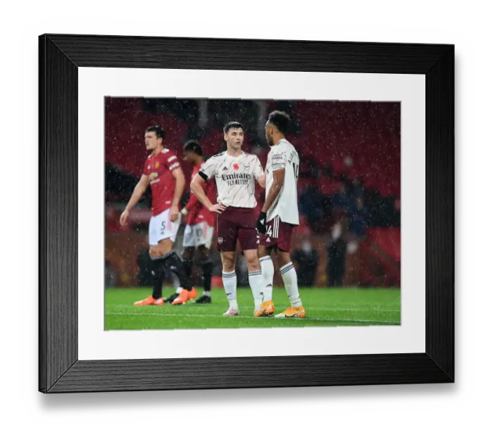 Framed Print : Arsenal's Tierney and Aubameyang Face Off Against Manchester United in Empty Old Trafford (2020-21)