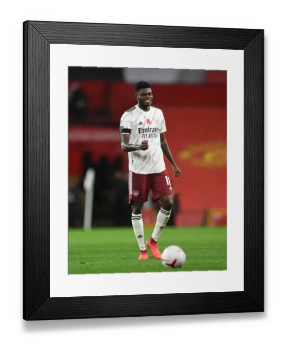 Framed Print : Thomas Partey's Celebration: Arsenal's Victory at Old Trafford in the 2020-21 Premier League (Behind Closed Doors) Framed Print : Thomas Partey's Celebration: Arsenal's Victory at Old Trafford in the 2020-21 Premier League (Behind Closed Doors)