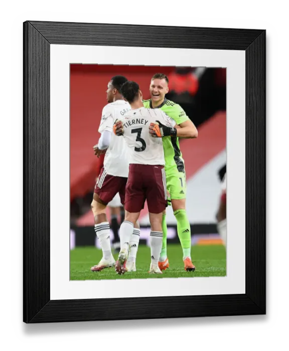 Framed Print : Arsenal's Victory at Old Trafford: Bernd Leno and Kieran Tierney Celebrate in Empty Old Trafford (Manchester United vs Arsenal, 2020-21)