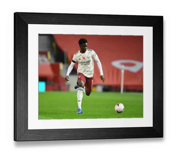 Framed Print : Behind Closed Doors: Bukayo Saka's Premier League Showdown at Old Trafford - Manchester United vs. Arsenal (2020-21)