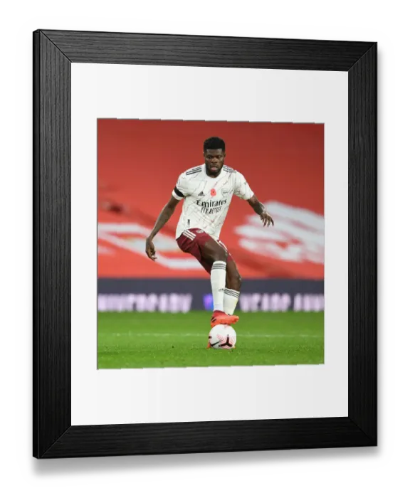 Framed Print : MANCHESTER, ENGLAND - NOVEMBER 01: Thomas Partey of Arsenal during the Premier League match between Manchester United Framed Print : MANCHESTER, ENGLAND - NOVEMBER 01: Thomas Partey of Arsenal during the Premier League match between Manchester United