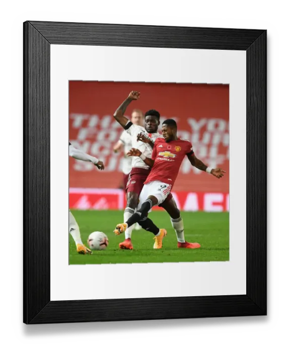 Framed Print : Thomas Partey vs Fred: A Battle in Empty Old Trafford - Premier League 2020-21: Arsenal's Midfield Clash Framed Print : Thomas Partey vs Fred: A Battle in Empty Old Trafford - Premier League 2020-21: Arsenal's Midfield Clash
