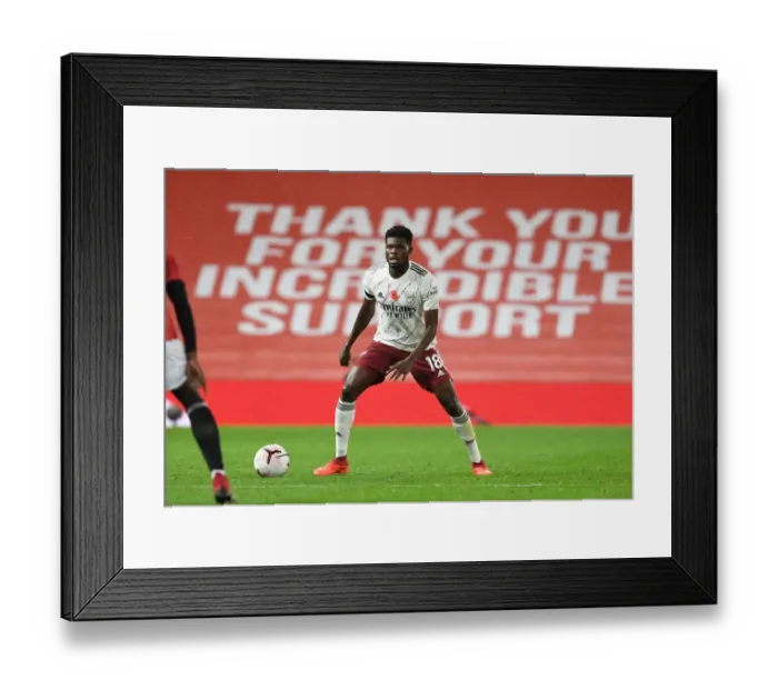Framed Print : Thomas Partey in Action: Manchester United vs. Arsenal, 2020-21 Premier League - Behind Closed Doors Framed Print : Thomas Partey in Action: Manchester United vs. Arsenal, 2020-21 Premier League - Behind Closed Doors