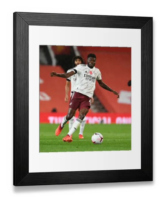 Framed Print : Thomas Partey in Action: Manchester United vs. Arsenal, Premier League 2020-21 (Behind Closed Doors) Framed Print : Thomas Partey in Action: Manchester United vs. Arsenal, Premier League 2020-21 (Behind Closed Doors)