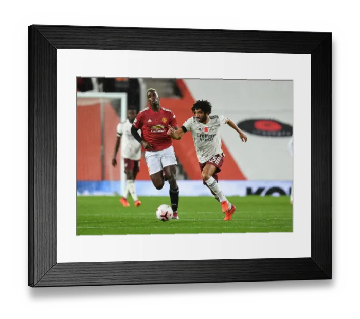 Framed Print : Arsenal's Mo Elneny Outmaneuvers Manchester United's Pogba in Empty Old Trafford Framed Print : Arsenal's Mo Elneny Outmaneuvers Manchester United's Pogba in Empty Old Trafford