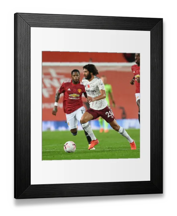 Framed Print : Arsenal's Mo Elneny at Manchester United: Premier League Clash Amidst Empty Stands (2020-21) Framed Print : Arsenal's Mo Elneny at Manchester United: Premier League Clash Amidst Empty Stands (2020-21)