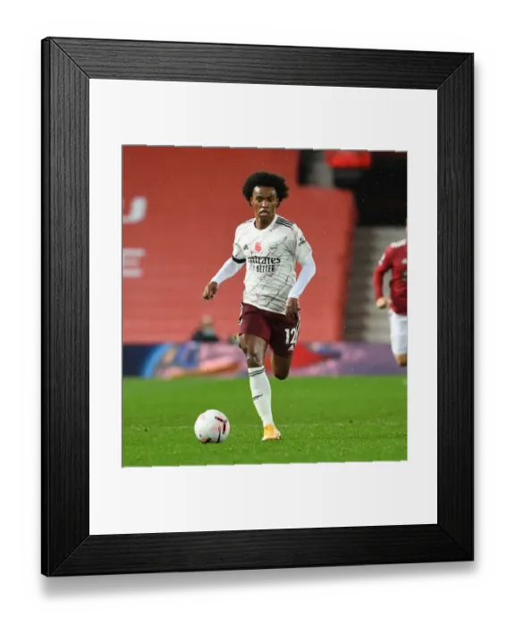 Framed Print : Arsenal's Willian Faces Manchester United in Empty Old Trafford (Manchester United vs Arsenal, 2020-21) Framed Print : Arsenal's Willian Faces Manchester United in Empty Old Trafford (Manchester United vs Arsenal, 2020-21)
