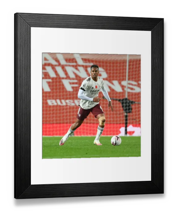 Framed Print : Gabriel Faces Empty Old Trafford: Arsenal vs Manchester United in the 2020-21 Premier League