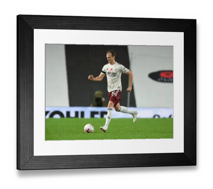 Framed Print : Rob Holding at Empty Old Trafford: Arsenal's 2020-21 Premier League Match Against Manchester United Framed Print : Rob Holding at Empty Old Trafford: Arsenal's 2020-21 Premier League Match Against Manchester United