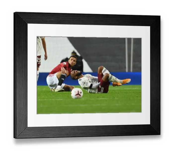 Framed Print : Manchester United vs Arsenal: Lacazette Fouls Greenwood in Empty Old Trafford (2020-21)