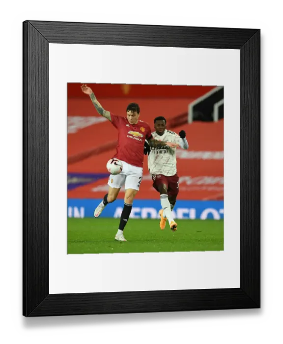 Framed Print : Manchester United vs Arsenal: Nketiah vs Lindelof Clash in Empty Old Trafford, Premier League 2020-21 Framed Print : Manchester United vs Arsenal: Nketiah vs Lindelof Clash in Empty Old Trafford, Premier League 2020-21