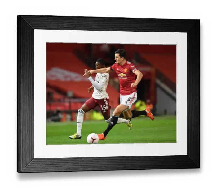 Framed Print : Maitland-Niles vs. Maguire: A Battle at Old Trafford - Manchester United vs. Arsenal, 2020-21