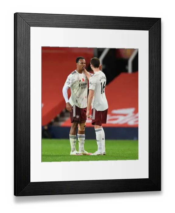 Framed Print : Arsenal's Gabriel and Holding: United Showdown in Empty Old Trafford (Manchester United vs Arsenal, 2020-21) Framed Print : Arsenal's Gabriel and Holding: United Showdown in Empty Old Trafford (Manchester United vs Arsenal, 2020-21)