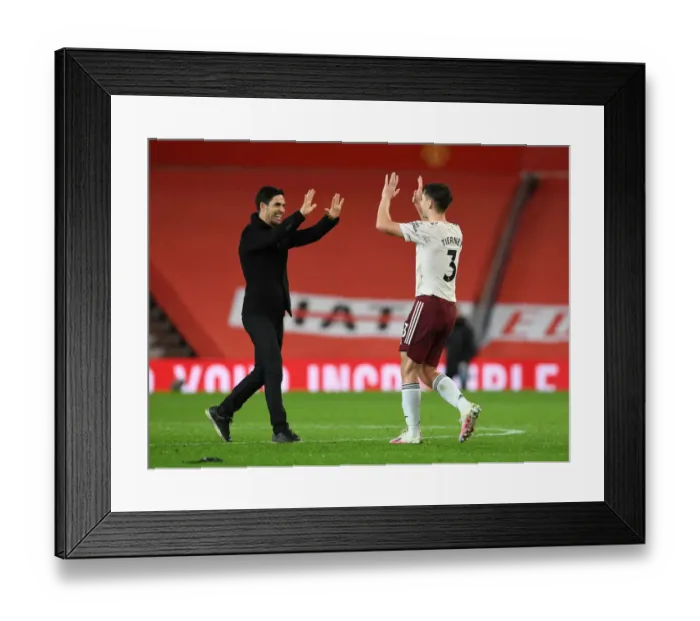Framed Print : Arsenal's Historic Victory at Old Trafford: Mikel Arteta and Kieran Tierney Celebrate Amidst Empty Stands (Manchester United vs Arsenal, 2020-21)