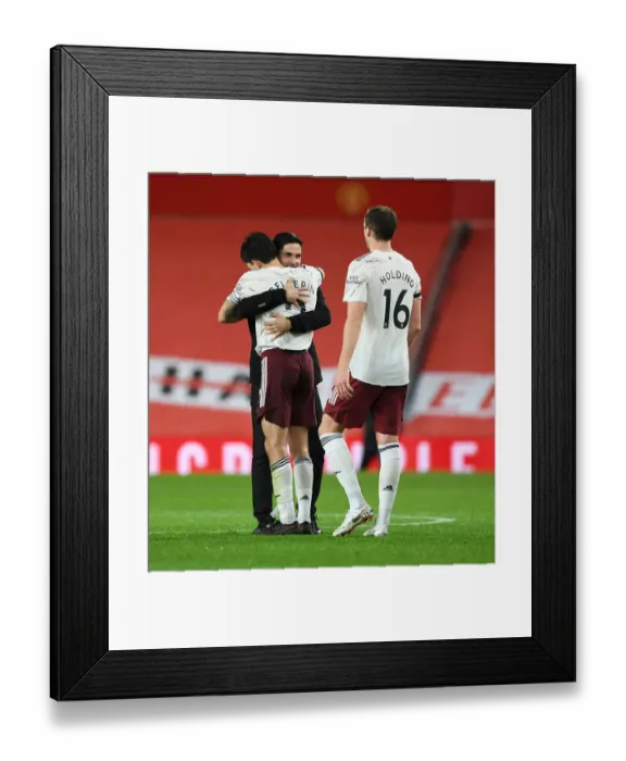 Framed Print : Arsenal's Victory at Old Trafford: Arteta and Bellerin Celebrate Amidst Empty Stands (Manchester United vs Arsenal, 2020-21) Framed Print : Arsenal's Victory at Old Trafford: Arteta and Bellerin Celebrate Amidst Empty Stands (Manchester United vs Arsenal, 2020-21)
