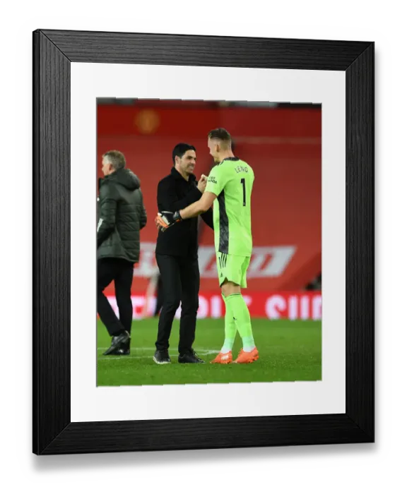Framed Print : Arsenal's Victory at Old Trafford: Arteta and Leno Celebrate a Rare Win Against Manchester United (2020-21)