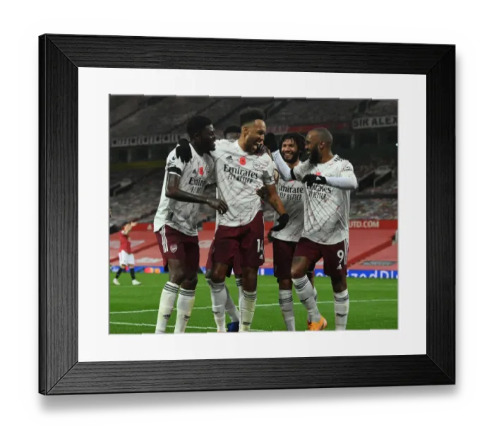 Framed Print : Aubameyang, Lacazette, and Partey Celebrate Arsenal's Goal Against Manchester United (2020-21)