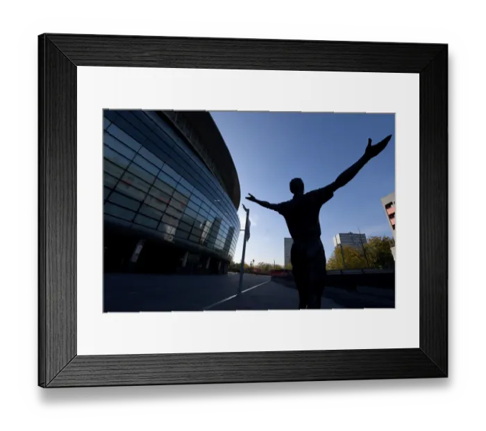 Framed Print : Tony Adams Statue: Arsenal's Legendary Captain Greets Europa League Opponents at Emirates Stadium