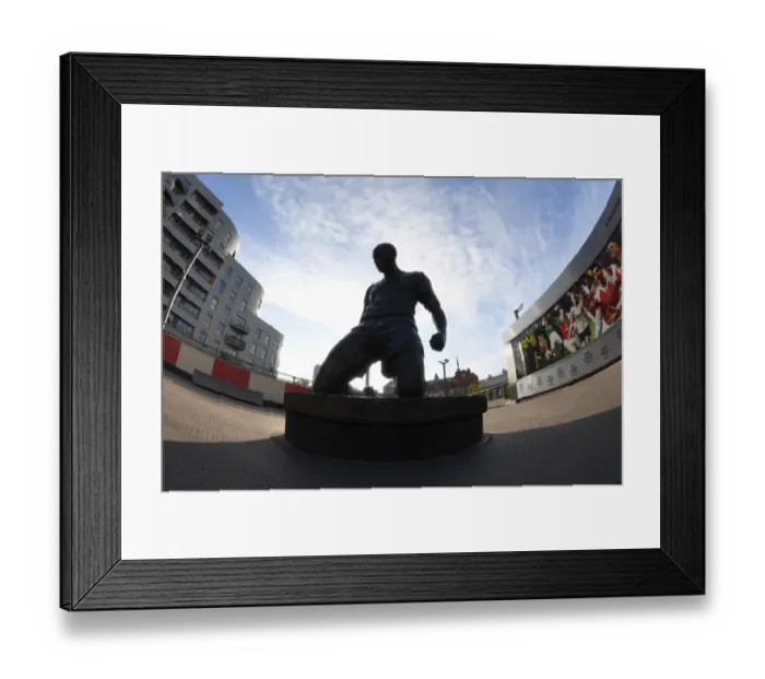 Framed Print : Thierry Henry's Enduring Legacy: A Statue of Greatness at Emirates Stadium during Europa League Play