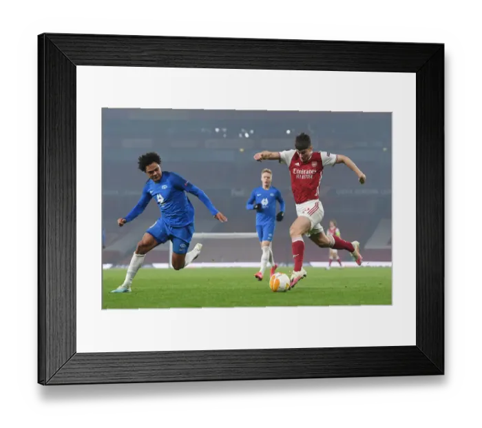 Framed Print : Arsenal's Kieran Tierney Fends Off Molde's Henry Wingo in Europa League Clash