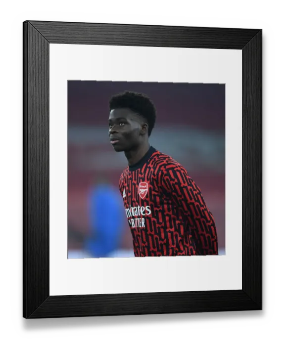 Framed Print : Arsenal's Bukayo Saka Readies for Europa League Battle Against Molde Framed Print : Arsenal's Bukayo Saka Readies for Europa League Battle Against Molde