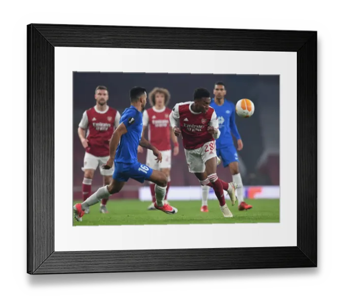 Framed Print : Arsenal's Joe Willock Scores Past Molde's Etzaz Aursnes in Europa League Clash Framed Print : Arsenal's Joe Willock Scores Past Molde's Etzaz Aursnes in Europa League Clash