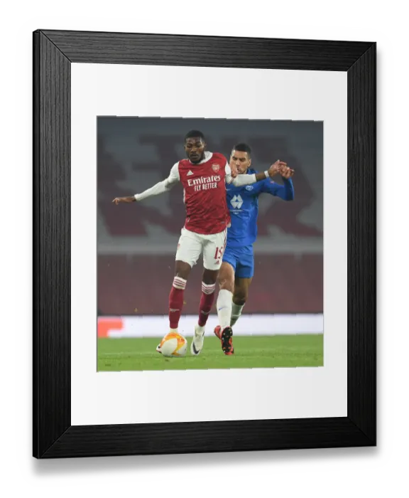 Framed Print : Maitland-Niles Outsmarts Omoijuanfo: Arsenal's Pivotal Moment in Europa League Victory