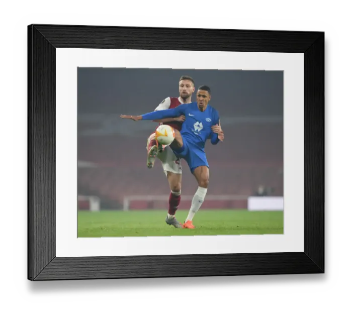 Framed Print : Arsenal vs Molde: Mustafi Clashes with Bolly in Europa League Showdown