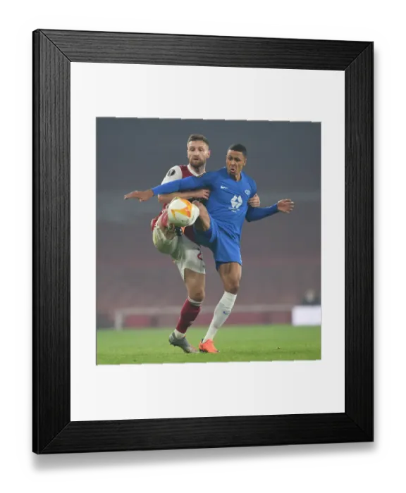 Framed Print : Mustafi vs Bolly: A Battle for Arsenal's Europa League Victory Framed Print : Mustafi vs Bolly: A Battle for Arsenal's Europa League Victory