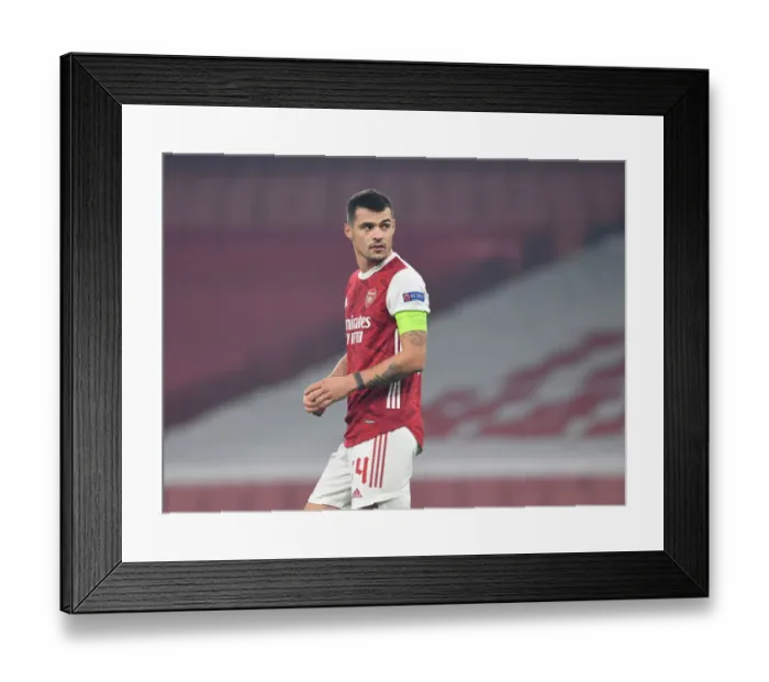 Framed Print : Granit Xhaka in Action: Arsenal's Europa League Battle against Molde FK (2020-21) Framed Print : Granit Xhaka in Action: Arsenal's Europa League Battle against Molde FK (2020-21)