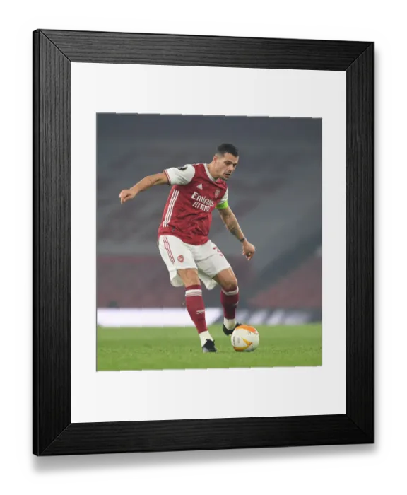 Framed Print : Granit Xhaka in Action: Arsenal's Europa League Battle against Molde FK Framed Print : Granit Xhaka in Action: Arsenal's Europa League Battle against Molde FK