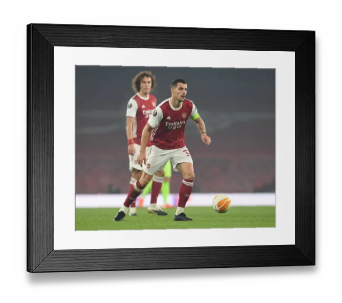 Framed Print : Granit Xhaka in Action: Arsenal's Europa League Battle against Molde FK Framed Print : Granit Xhaka in Action: Arsenal's Europa League Battle against Molde FK