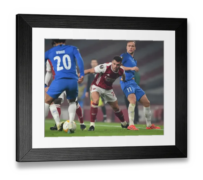 Framed Print : Xhaka vs Ellingsen: A Europa League Battle at the Emirates