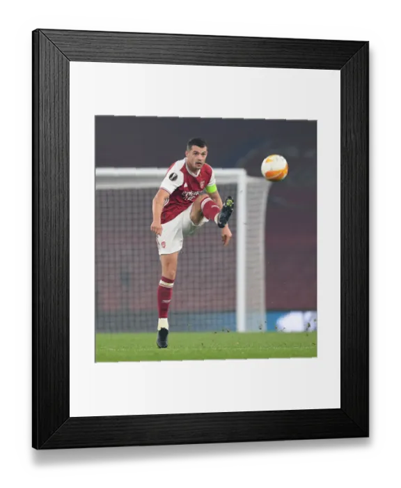 Framed Print : Granit Xhaka in Action: Arsenal's Europa League Battle against Molde FK Framed Print : Granit Xhaka in Action: Arsenal's Europa League Battle against Molde FK