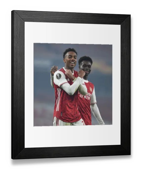 Framed Print : Arsenal's Joe Willock and Bukayo Saka Celebrate Goals in Europa League Victory