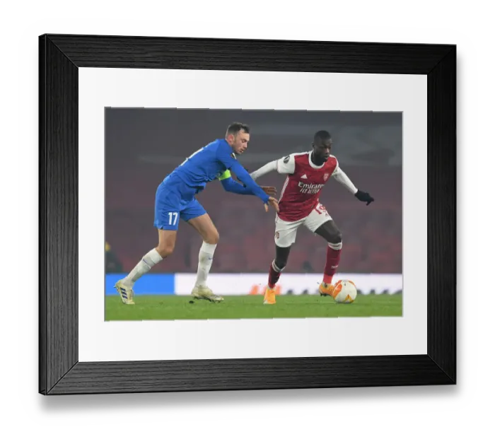 Framed Print : Arsenal's Nicolas Pepe Clashes with Molde's Fredrik Aursnes in Europa League Showdown