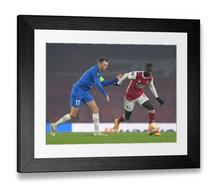 Framed Print : Pepe vs Aursnes: Arsenal's Star Forward Clashes with Molde's Defender in Europa League Showdown