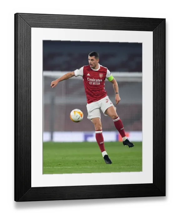 Framed Print : Granit Xhaka in Action: Arsenal's Europa League Battle against Molde FK Framed Print : Granit Xhaka in Action: Arsenal's Europa League Battle against Molde FK