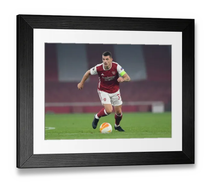 Framed Print : Granit Xhaka in Action: Arsenal's Europa League Battle against Molde FK Framed Print : Granit Xhaka in Action: Arsenal's Europa League Battle against Molde FK