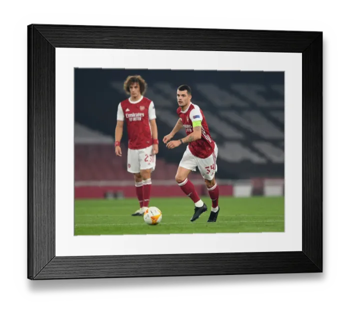 Framed Print : Arsenal's Granit Xhaka in Action against Molde FK in Europa League Group Stage