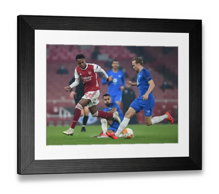 Framed Print : Arsenal's Joe Willock Goes Head-to-Head with Molde's Stian Gregersen in Europa League Showdown