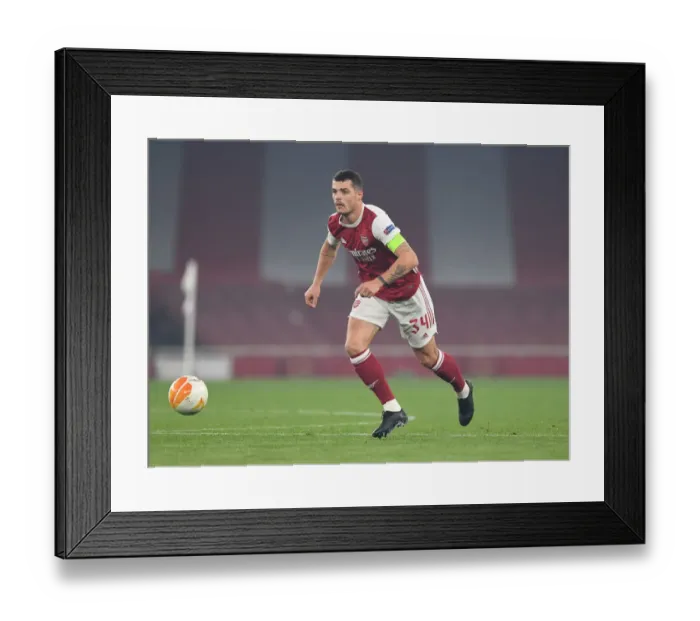 Framed Print : Granit Xhaka in Action: Arsenal's Europa League Battle against Molde FK
