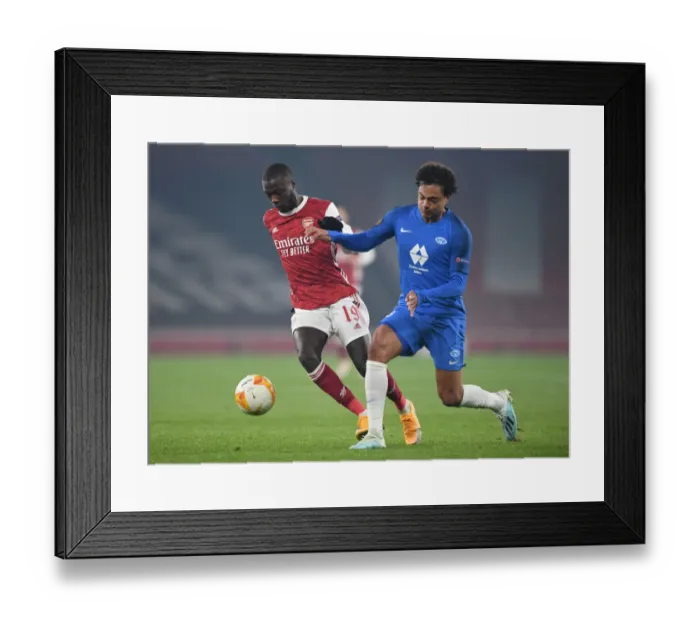 Framed Print : Arsenal vs Molde: Pepe Clashes with Wingo in Europa League Showdown