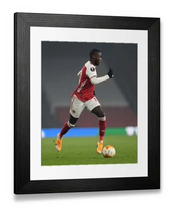 Framed Print : Arsenal's Nicolas Pepe in Action against Molde FK in Europa League Group Stage