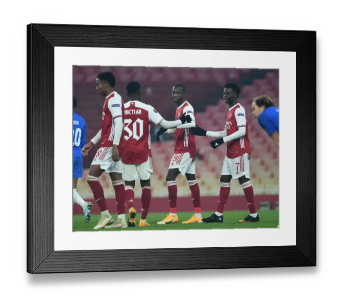 Framed Print : Arsenal's Nicolas Pepe Scores Third Goal Against Molde FK in Europa League Match Framed Print : Arsenal's Nicolas Pepe Scores Third Goal Against Molde FK in Europa League Match