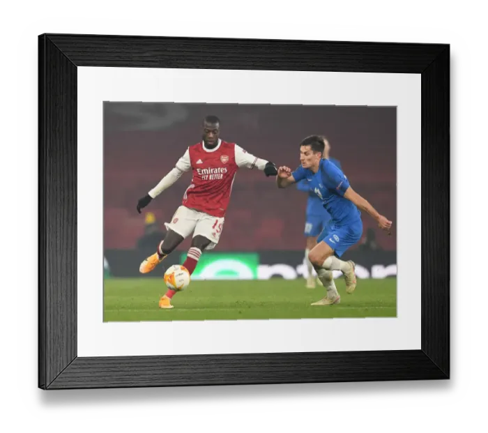 Framed Print : Arsenal's Nicolas Pepe Clashes with Molde's Kristoffer Haugen in Europa League Battle