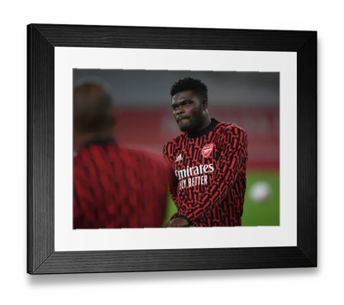 Framed Print : Thomas Partey Prepares for Aston Villa Showdown at Empty Emirates Stadium (2020-21)